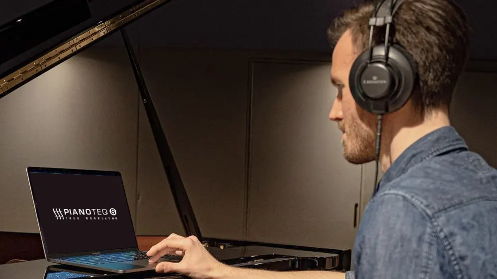 C. Bechstein Connect Piano System - Sampling - Picture of person at Bechstein piano with headphones and tablet